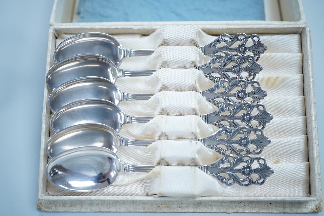 Small silver including a three piece cruet set, by George Howson, Sheffield, 1924/5/6, a napkin ring, a cream jug and a set of six 830s coffee spoons.